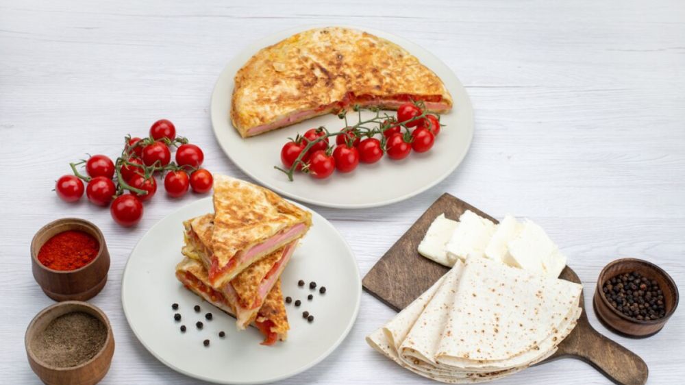 Сырные лепёшки на кефире: быстрый и вкусный завтрак Сырные лепёшки на кефире: быстрый и вкусный завтрак